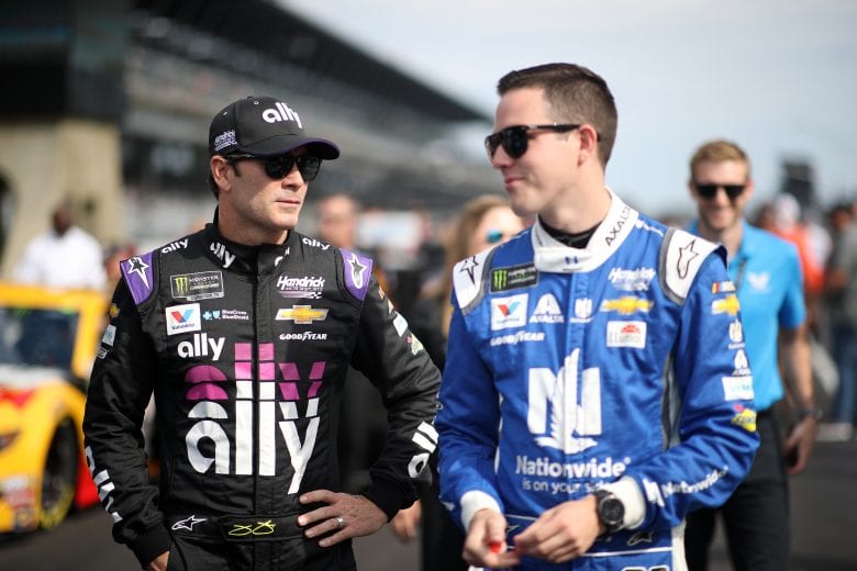 INDIANAPOLIS, INDIANA - SEPTEMBER 07: Alex Bowman, driver of the #88 Nationwide Chevrolet, talks with Jimmie Johnson, driver of the #48 Ally Chevrolet, during qualifying for the Monster Energy NASCAR Cup Series Big Machine Vodka 400 at the Brickyard at Indianapolis Motor Speedway on September 08, 2019 in Indianapolis, Indiana. (Photo by Chris Graythen/Getty Images) | Getty Images