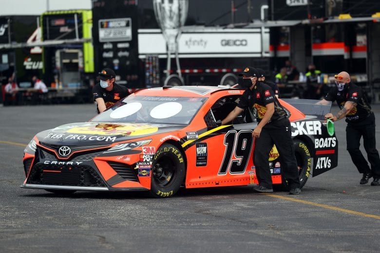 DARLINGTON, SOUTH CAROLINA - MAY 17: The crew push the #19 Bass Pro Shops Toyota, driven by Martin Truex Jr.of through the garage area prior to the NASCAR Cup Series The Real Heroes 400 at Darlington Raceway on May 17, 2020 in Darlington, South Carolina. NASCAR resumes the season after the nationwide lockdown due to the ongoing Coronavirus (COVID-19). (Photo by Chris Graythen/Getty Images) | Getty Images