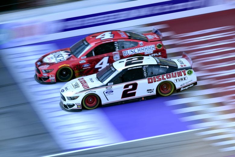 BROOKLYN, MICHIGAN - AUGUST 08: Brad Keselowski, driver of the #2 Discount Tire Ford, races Kevin Harvick, driver of the #4 Busch Light Apple Ford, during the NASCAR Cup Series FireKeepers Casino 400 at Michigan International Speedway on August 08, 2020 in Brooklyn, Michigan. (Photo by Jared C. Tilton/Getty Images) | Getty Images