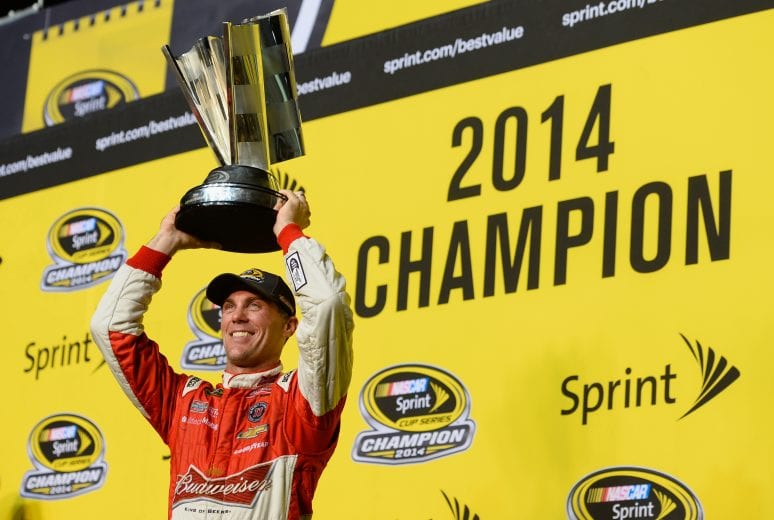 HOMESTEAD, FL - NOVEMBER 16: Kevin Harvick, driver of the #4 Budweiser Chevrolet, celebrates with the trophy in victory lane after winning the NASCAR Sprint Cup Series Ford EcoBoost 400 at Homestead-Miami Speedway on November 16, 2014 in Homestead, Florida. (Photo by Robert Laberge/Getty Images) | Getty Images