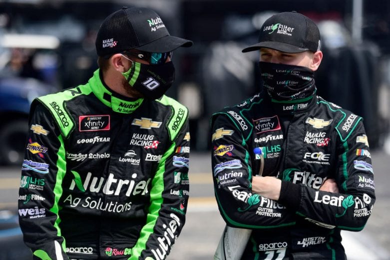 DARLINGTON, SOUTH CAROLINA - SEPTEMBER 05: Ross Chastain, driver of the #10 Nutrien Ag Solutions Chevrolet, and Justin Haley, driver of the #11 LeafFilter Gutter Protection Chevrolet, talk on the grid prior to the NASCAR Xfinity Series Sport Clips Haircuts VFW 200 at Darlington Raceway on September 05, 2020 in Darlington, South Carolina. (Photo by Jared C. Tilton/Getty Images) | Getty Images