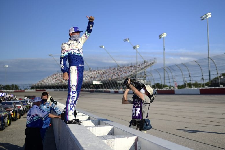 DARLINGTON, SOUTH CAROLINA - SEPTEMBER 06: Clint Bowyer, driver of the #14 PEAK Throwback Ford, give a thumbs up to fans from the grid prior to the NASCAR Cup Series Cook Out Southern 500 at Darlington Raceway on September 06, 2020 in Darlington, South Carolina. (Photo by Jared C. Tilton/Getty Images) | Getty Images