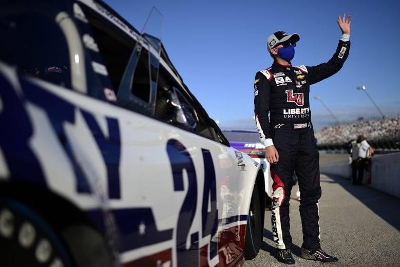 DARLINGTON, SOUTH CAROLINA - SEPTEMBER 06: William Byron, driver of the #24 Liberty Univeristy Throwback Chevrolet, waves to fans from the grid prior to the NASCAR Cup Series Cook Out Southern 500 at Darlington Raceway on September 06, 2020 in Darlington, South Carolina. (Photo by Jared C. Tilton/Getty Images) | Getty Images