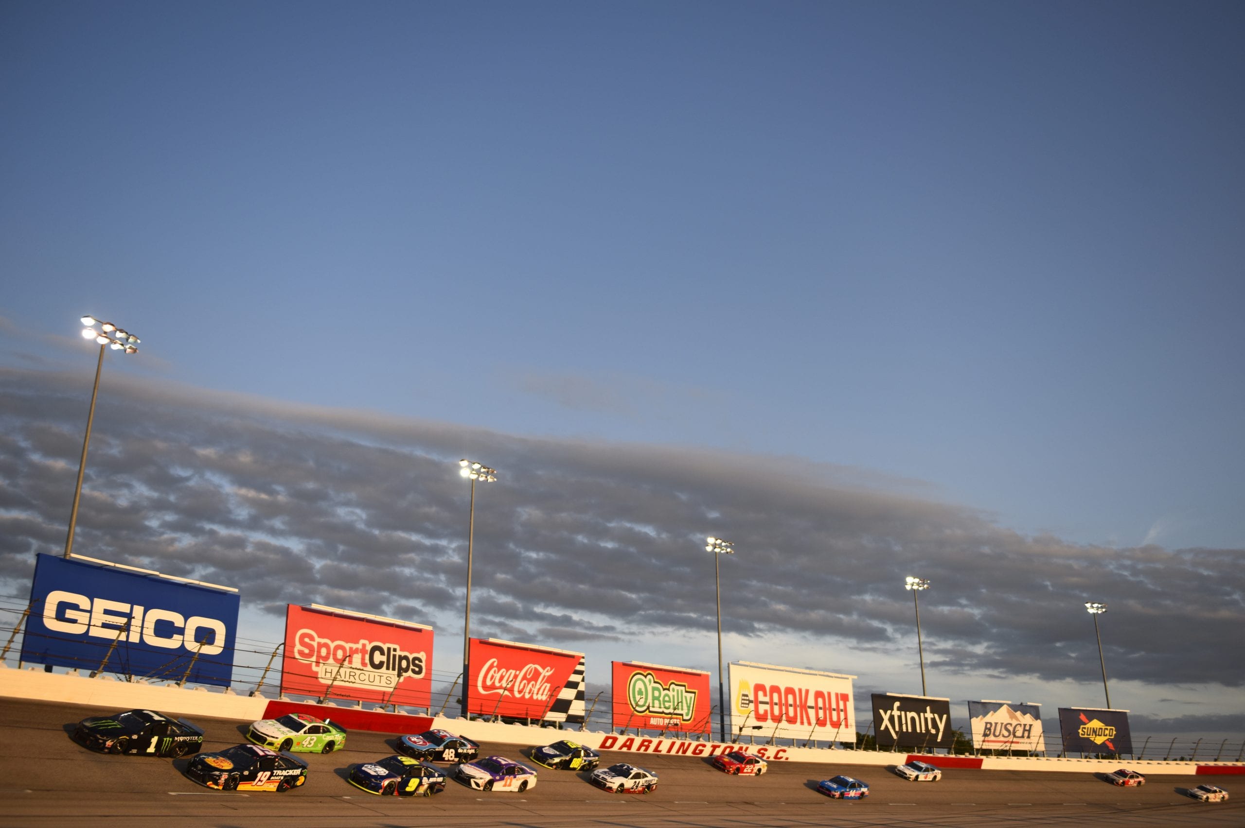DARLINGTON, SOUTH CAROLINA - SEPTEMBER 06: Kurt Busch, driver of the #1 Monster Energy Chevrolet, and Martin Truex Jr., driver of the #19 Bass Pro Shops Toyota, lead the field during the NASCAR Cup Series Cook Out Southern 500 at Darlington Raceway on September 06, 2020 in Darlington, South Carolina. (Photo by Jared C. Tilton/Getty Images) | Getty Images