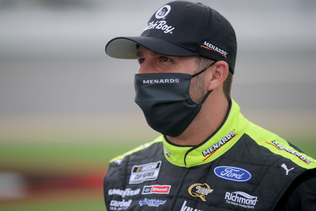 DAYTONA BEACH, FLORIDA - AUGUST 29: Matt DiBenedetto, driver of the #21 Menards/Dutch Boy Ford, stands on the grid prior to the NASCAR Cup Series Coke Zero Sugar 400 at Daytona International Speedway on August 29, 2020 in Daytona Beach, Florida. (Photo by Chris Graythen/Getty Images) | Getty Images