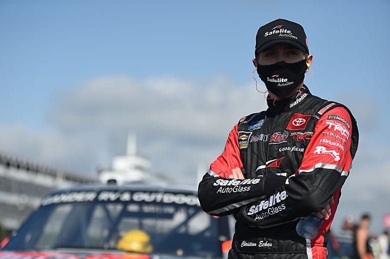 LONG POND, PENNSYLVANIA - JUNE 28: Christian Eckes, driver of the #18 Safelite AutoGlass Toyota, waits on the grid prior to the NASCAR Gander RV & Outdoors Truck Series Pocono Organics 150 to benefit Farm Aid at Pocono Raceway on June 28, 2020 in Long Pond, Pennsylvania. (Photo by Jared C. Tilton/Getty Images) | Getty Images