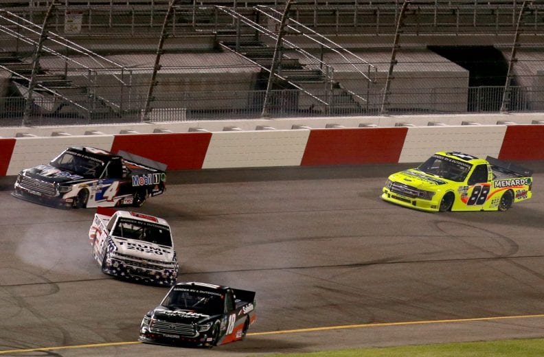 RICHMOND, VIRGINIA - SEPTEMBER 10: Tim Viens, driver of the #83 CMI Motorsports Chevrolet, spins as Christian Eckes, driver of the #18 Safelite AutoGlass Toyota, Raphael Lessard, driver of the #4 Mobil 1 Toyota, and Matt Crafton, driver of the #88 Ideal Door/Menards Ford, pass during the NASCAR Gander Outdoors Truck Series ToyotaCare 250 at Richmond Raceway on September 10, 2020 in Richmond, Virginia. (Photo by Sean Gardner/Getty Images) | Getty Images