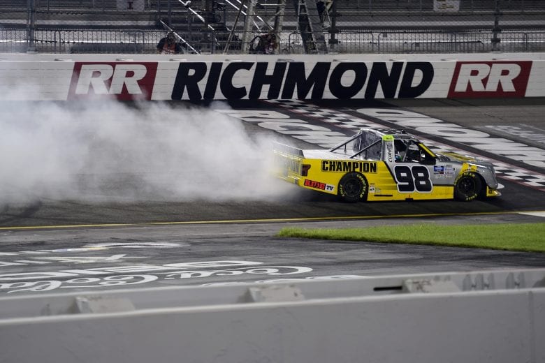 RICHMOND, VIRGINIA - SEPTEMBER 10: Grant Enfinger, driver of the #98 Champion/Curb Records Ford, celebrates with a burnout after winning the NASCAR Gander Outdoors Truck Series ToyotaCare 250 at Richmond Raceway on September 10, 2020 in Richmond, Virginia. (Photo by Jared C. Tilton/Getty Images) | Getty Images