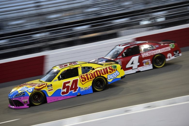 RICHMOND, VIRGINIA - SEPTEMBER 11: Denny Hamlin, driver of the #54 SportClips Toyota, and Jesse Little, driver of the #4 Shriners Hospitals Chevrolet, race during the NASCAR Xfinity Series Go Bowling 250 at Richmond Raceway on September 11, 2020 in Richmond, Virginia. (Photo by Jared C. Tilton/Getty Images) | Getty Images