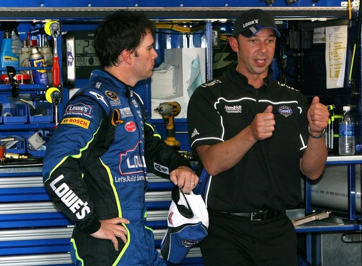 TALLADEGA, AL - APRIL 25:  Jimmie Johnson, driver of the #48 Lowe's Chevrolet, speaks with crew chief Chad Knaus, during practice for the NASCAR Sprint Cup Series Aaron's 499 at Talladega Superspeedway on April 25, 2008 in Talladega, Alabama.  (Photo by Kevin C. Cox/Getty Images) | Getty Images