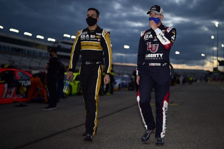 RICHMOND, VIRGINIA - SEPTEMBER 12: Alex Bowman, driver of the #88 ChevyGoods.com/Truck Hero Chevrolet, and William Byron, driver of the #24 Liberty University Chevrolet, walks the grid prior to the NASCAR Cup Series Federated Auto Parts 400 at Richmond Raceway on September 12, 2020 in Richmond, Virginia. (Photo by Jared C. Tilton/Getty Images) | Getty Images