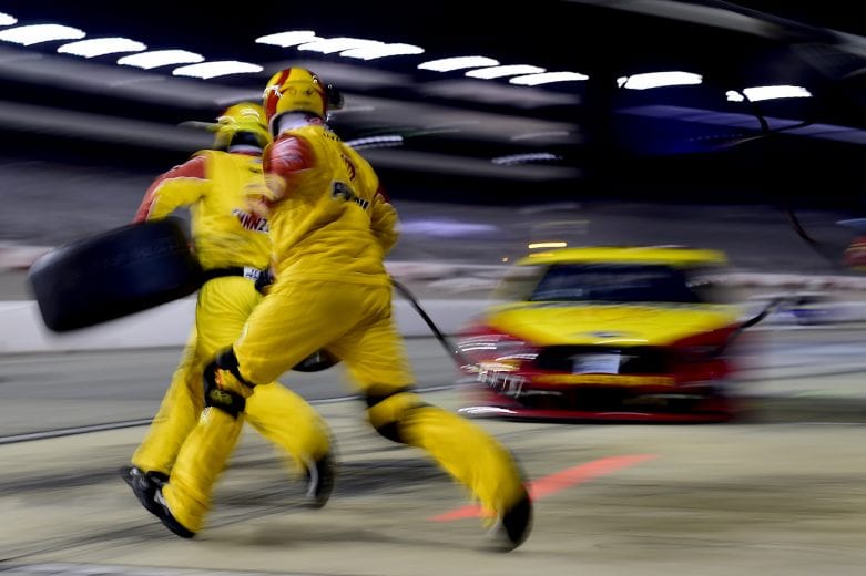 RICHMOND, VIRGINIA - The crew SEPTEMBER 12:  The crew of the #22 Shell Pennzoil Ford, driven by Joey Logano, jump into action during the NASCAR Cup Series Federated Auto Parts 400 at Richmond Raceway on September 12, 2020 in Richmond, Virginia. (Photo by Jared C. Tilton/Getty Images) | Getty Images