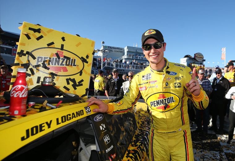 LAS VEGAS, NEVADA - FEBRUARY 23: Joey Logano, driver of the #22 Pennzoil Ford, applies the winner's sticker after the NASCAR Cup Series Penzoil 400 presented by Jiffy Lube at Las Vegas Motor Speedway on February 23, 2020 in Las Vegas, Nevada. (Photo by Matt Sullivan/Getty Images) | Getty Images