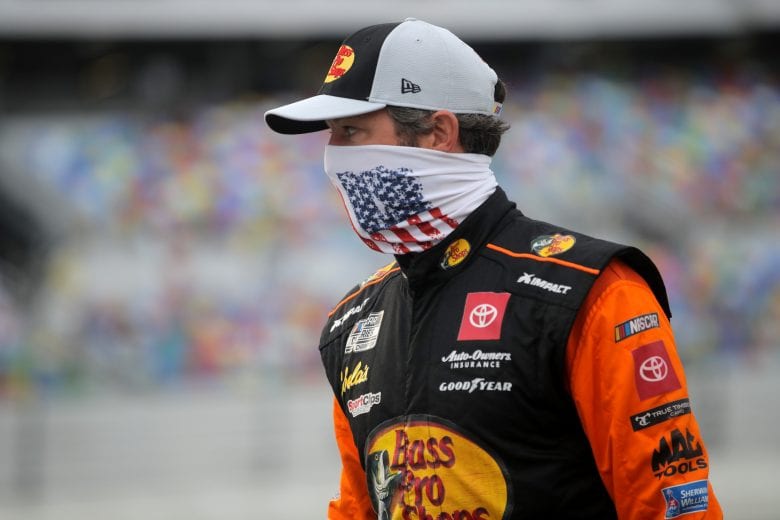 DAYTONA BEACH, FLORIDA - AUGUST 29: Martin Truex Jr., driver of the #19 Bass Pro Shops Toyota, walks on the grid prior to the NASCAR Cup Series Coke Zero Sugar 400 at Daytona International Speedway on August 29, 2020 in Daytona Beach, Florida. (Photo by Chris Graythen/Getty Images) | Getty Images