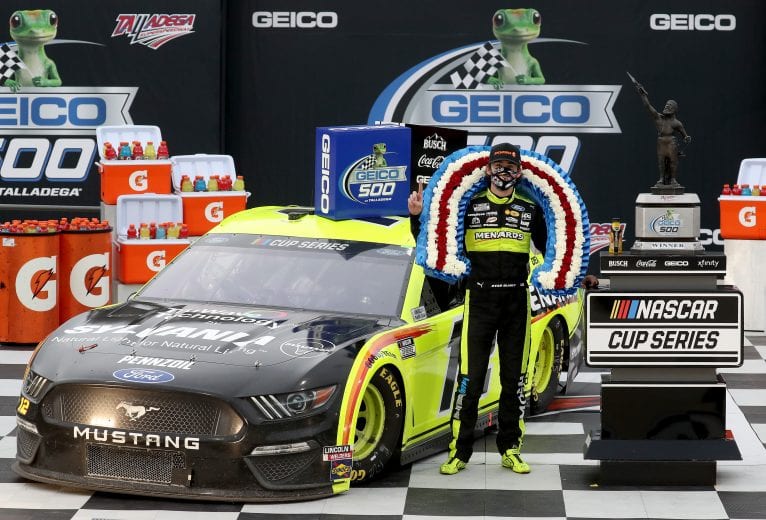 TALLADEGA, ALABAMA - JUNE 22: Ryan Blaney, driver of the #12 Menards/Sylvania Ford, celebrates in Victory Lane after winning the NASCAR Cup Series GEICO 500 at Talladega Superspeedway on June 22, 2020 in Talladega, Alabama. (Photo by Chris Graythen/Getty Images) | Getty Images