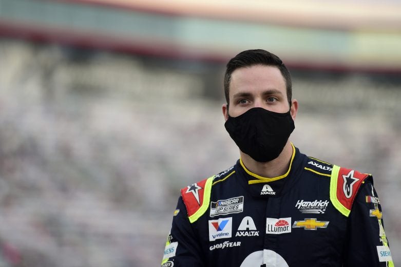 BRISTOL, TENNESSEE - SEPTEMBER 19: Alex Bowman, driver of the #88 Axalta Chevrolet, stands on the grid prior to the NASCAR Cup Series Bass Pro Shops Night Race at Bristol Motor Speedway on September 19, 2020 in Bristol, Tennessee. (Photo by Jared C. Tilton/Getty Images) | Getty Images