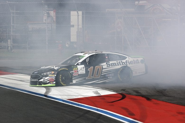 CHARLOTTE, NC - SEPTEMBER 28:  Aric Almirola, driver of the #10 Smithfield Ford, spins during practice for the Monster Energy NASCAR Cup Series Bank of America Roval 400 at Charlotte Motor Speedway on September 28, 2018 in Charlotte, North Carolina.  (Photo by Streeter Lecka/Getty Images) | Getty Images