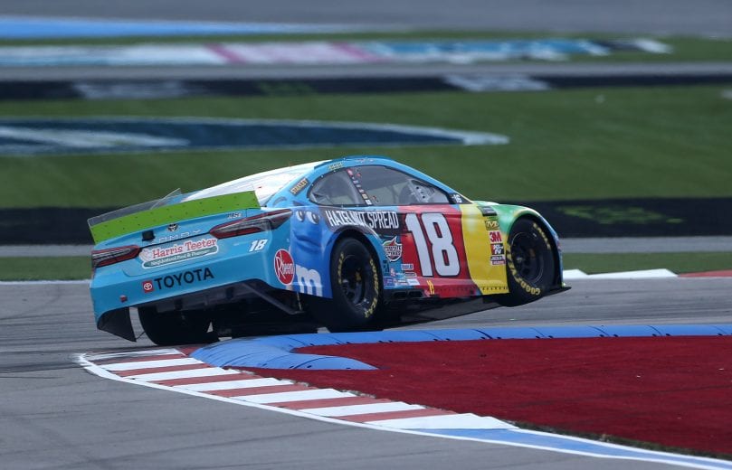 CHARLOTTE, NORTH CAROLINA - SEPTEMBER 29: Kyle Busch, driver of the #18 M&M's Hazelnut Toyota, races during the Monster Energy NASCAR Cup Series Bank of America ROVAL 400 at Charlotte Motor Speedway on September 29, 2019 in Charlotte, North Carolina. (Photo by Brian Lawdermilk/Getty Images) | Getty Images