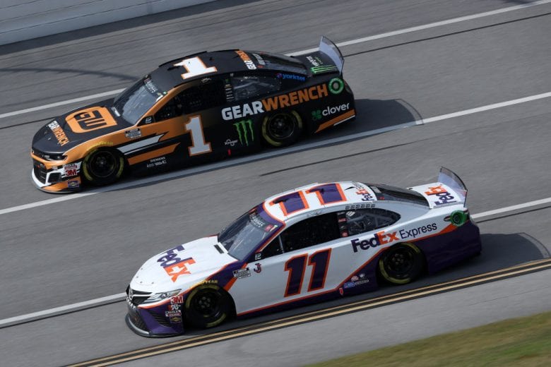 TALLADEGA, ALABAMA - OCTOBER 04: Denny Hamlin, driver of the #11 FedEx Express Toyota, and Kurt Busch, driver of the #1 GEARWRENCH Chevrolet, race during the NASCAR Cup Series YellaWood 500 at Talladega Superspeedway on October 04, 2020 in Talladega, Alabama. (Photo by Chris Graythen/Getty Images) | Getty Images