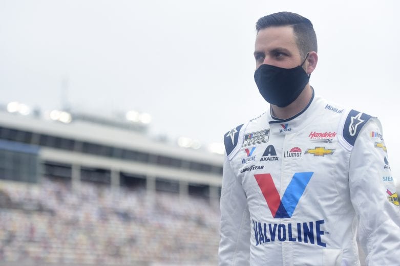 CONCORD, NORTH CAROLINA - OCTOBER 11: Alex Bowman, driver of the #88 Valvoline Chevrolet, walks the grid prior to the NASCAR Cup Series Bank of America ROVAL 400 at Charlotte Motor Speedway on October 11, 2020 in Concord, North Carolina. (Photo by Jared C. Tilton/Getty Images) | Getty Images