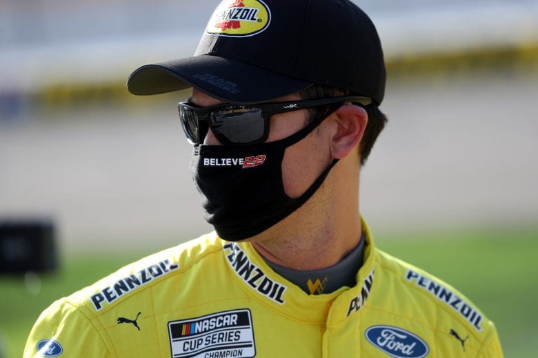LAS VEGAS, NEVADA - SEPTEMBER 27: Joey Logano, driver of the #22 Pennzoil Ford, stands on the grid prior to the NASCAR Cup Series South Point 400 at Las Vegas Motor Speedway on September 27, 2020 in Las Vegas, Nevada. (Photo by Chris Graythen/Getty Images) | Getty Images