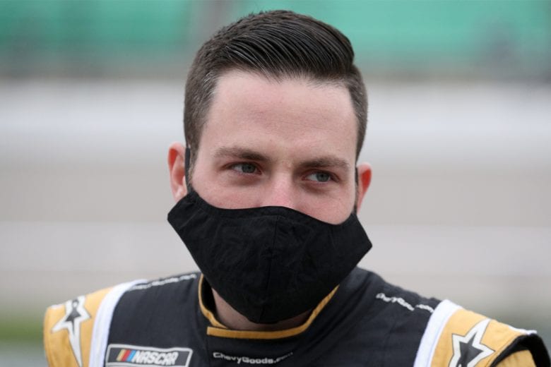 KANSAS CITY, KANSAS - OCTOBER 18: Alex Bowman, driver of the #88 ChevyGoods.com/Truck Hero Chevrolet, waits on the grid prior to the NASCAR Cup Series  Hollywood Casino 400 at Kansas Speedway on October 18, 2020 in Kansas City, Kansas. (Photo by Chris Graythen/Getty Images) | Getty Images