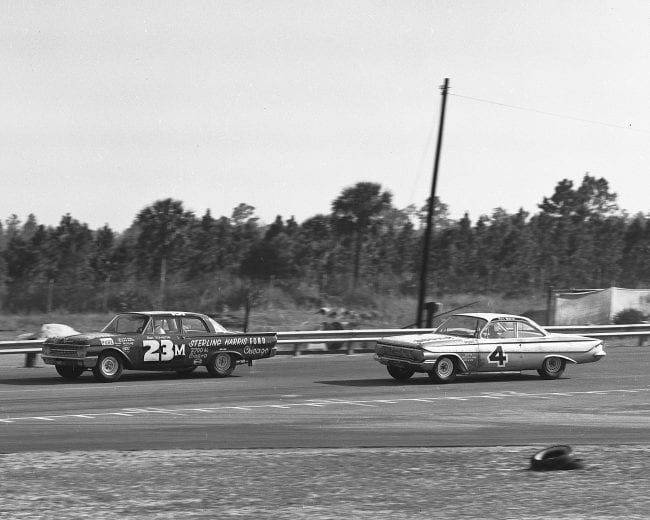 DAYTONA BEACH, FL — February 12, 1961: A pair of 10-lap races were held to determine the pole positions for the twin 100-mile qualifying races for the Daytona 500 NASCAR Cup race at Daytona International Speedway. In the second of those races, Sal Tovella in a 1961 Ford (No. 23) leads defending NASCAR Cup champion Rex White’s 1961 Chevrolet (No. 4). (Photo by ISC Images & Archives via Getty Images)