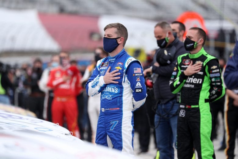 FORT WORTH, TEXAS - OCTOBER 24: Justin Allgaier, driver of the #7 Sam's Club/Hellmann's Chevrolet, stands during the national anthem prior to the NASCAR Xfinity Series O'Reilly Auto Parts 300 at Texas Motor Speedway on October 24, 2020 in Fort Worth, Texas. (Photo by Chris Graythen/Getty Images) | Getty Images