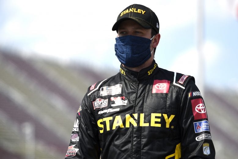 BROOKLYN, MICHIGAN - AUGUST 09: Erik Jones, driver of the #20 STANLEY Toyota, walks the grid prior to the NASCAR Cup Series Consumers Energy 400 at Michigan International Speedway on August 09, 2020 in Brooklyn, Michigan. (Photo by Jared C. Tilton/Getty Images) | Getty Images