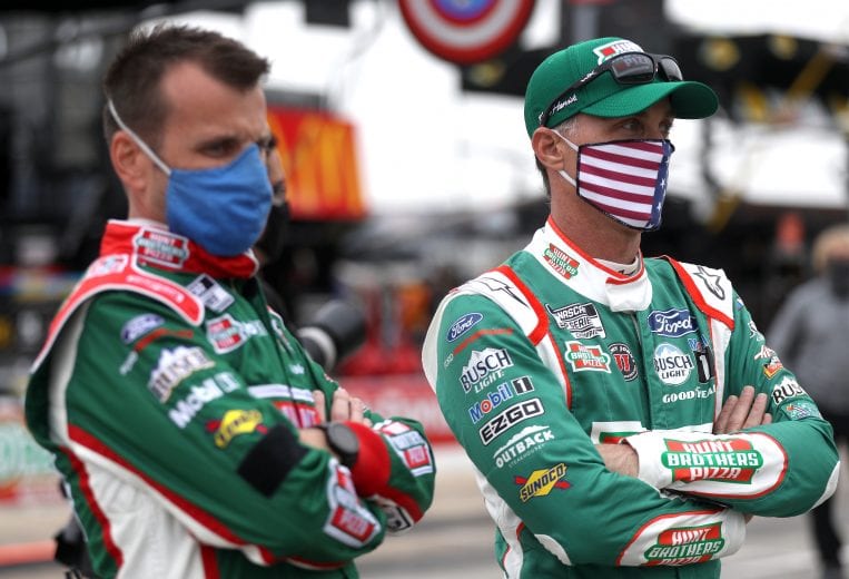 FORT WORTH, TEXAS - OCTOBER 25: Kevin Harvick, driver of the #4 Hunt Brothers Pizza Ford, and crew chief Rodney Childers wait on the grid prior to the NASCAR Cup Series Autotrader EchoPark Automotive 500 at Texas Motor Speedway on October 25, 2020 in Fort Worth, Texas. (Photo by Chris Graythen/Getty Images) | Getty Images