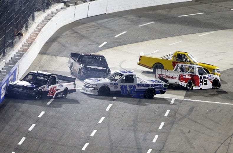 MARTINSVILLE, VIRGINIA - OCTOBER 30: Tanner Gray, driver of the #15 Ford Performance Ford, Tate Fogleman, driver of the #02 Solid Rock Carriers Chevrolet, Trevor Bayne, driver of the #45 CRC Brakleen Chevrolet, Josh Reaume, driver of the #33 Toyota, and Ray Ciccarelli, driver of the #83 CMI Motorsports Chevrolet, spin after an on-track incident during the NASCAR Gander RV & Outdoors Truck Series NASCAR Hall of Fame 200 at Martinsville Speedway on October 30, 2020 in Martinsville, Virginia. (Photo by Brian Lawdermilk/Getty Images) | Getty Images