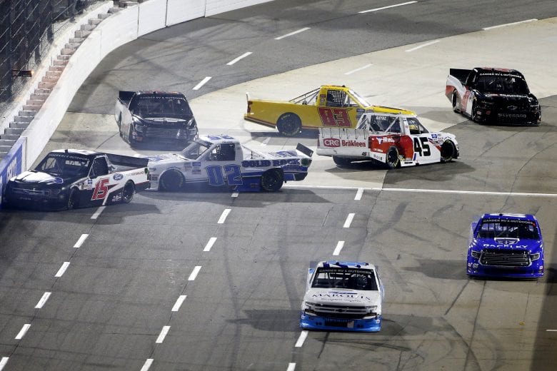 MARTINSVILLE, VIRGINIA - OCTOBER 30: Tanner Gray, driver of the #15 Ford Performance Ford, Tate Fogleman, driver of the #02 Solid Rock Carriers Chevrolet, Trevor Bayne, driver of the #45 CRC Brakleen Chevrolet, Josh Reaume, driver of the #33 Toyota, and Ray Ciccarelli, driver of the #83 CMI Motorsports Chevrolet, spin after an on-track incident during the NASCAR Gander RV & Outdoors Truck Series NASCAR Hall of Fame 200 at Martinsville Speedway on October 30, 2020 in Martinsville, Virginia. (Photo by Brian Lawdermilk/Getty Images) | Getty Images