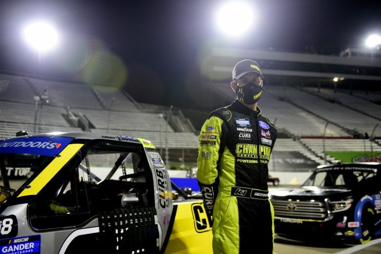 MARTINSVILLE, VIRGINIA - OCTOBER 30: Grant Enfinger, driver of the #98 Champion/Curb Records Ford, waits on the grid prior to the NASCAR Gander RV & Outdoors Truck Series NASCAR Hall of Fame 200 at Martinsville Speedway on October 30, 2020 in Martinsville, Virginia. (Photo by Jared C. Tilton/Getty Images) | Getty Images
