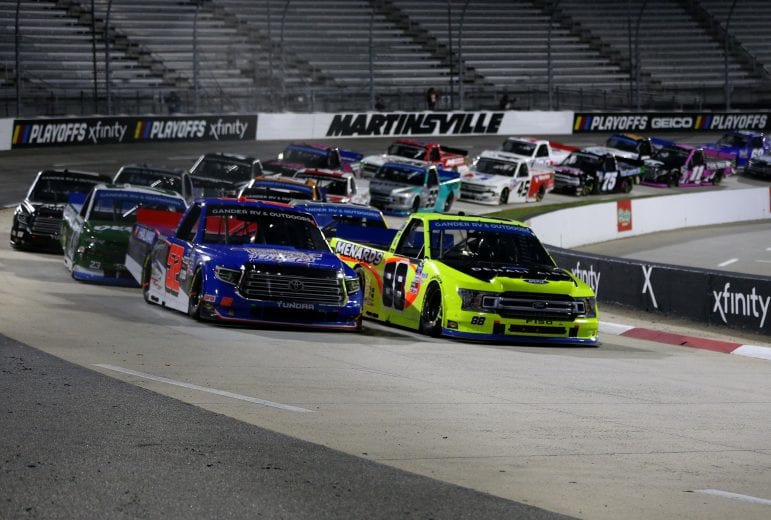 MARTINSVILLE, VIRGINIA - OCTOBER 30: Matt Crafton, driver of the #88 Denali Aire/Menards Ford, and Stewart Friesen, driver of the #52 Halmar Racing To Beat Hunger Toyota, race during the NASCAR Gander RV & Outdoors Truck Series NASCAR Hall of Fame 200 at Martinsville Speedway on October 30, 2020 in Martinsville, Virginia. (Photo by Brian Lawdermilk/Getty Images) | Getty Images