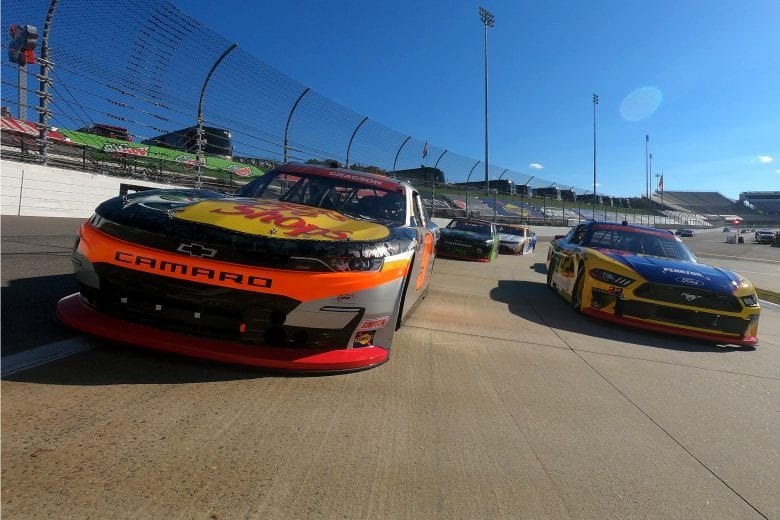 MARTINSVILLE, VIRGINIA - OCTOBER 31: Noah Gragson, driver of the #9 Bass Pro Shops/TrueTimber Camo Chevrolet, and Austin Cindric, driver of the #22 Pirtek Ford, lead the field on a pace lap prior to the NASCAR Xfinity Series Draft Top 250 at Martinsville Speedway on October 31, 2020 in Martinsville, Virginia. (Photo by Jared C. Tilton/Getty Images) | Getty Images
