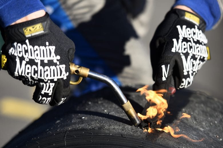 MARTINSVILLE, VIRGINIA - OCTOBER 31: A crew members works on a tire during the NASCAR Xfinity Series Draft Top 250 at Martinsville Speedway on October 31, 2020 in Martinsville, Virginia. (Photo by Jared C. Tilton/Getty Images) | Getty Images