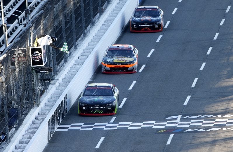 MARTINSVILLE, VIRGINIA - OCTOBER 31: Ross Chastain, driver of the #10 Nutrien Ag Solutions Chevrolet, win stage two over Noah Gragson, driver of the #9 Bass Pro Shops/TrueTimber Camo Chevrolet, and Justin Haley, driver of the #11 LeafFilter Gutter Protection Chevrolet, during the NASCAR Xfinity Series Draft Top 250 at Martinsville Speedway on October 31, 2020 in Martinsville, Virginia. (Photo by Brian Lawdermilk/Getty Images) | Getty Images