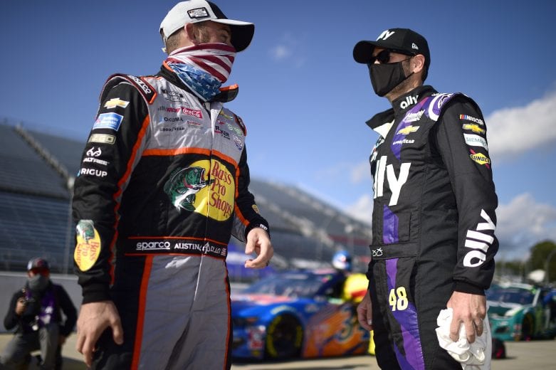 MARTINSVILLE, VIRGINIA - NOVEMBER 01: Jimmie Johnson, driver of the #48 Sign for Jimmie Chevrolet, and Austin Dillon, driver of the #3 Bass Pro Shops/Tracker Off Road Chevrolet, talk on the grid prior to the NASCAR Cup Series Xfinity 500 at Martinsville Speedway on November 01, 2020 in Martinsville, Virginia. (Photo by Jared C. Tilton/Getty Images) | Getty Images