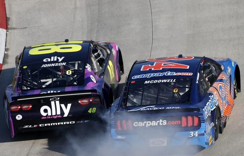MARTINSVILLE, VIRGINIA - NOVEMBER 01: Jimmie Johnson, driver of the #48 Sign for Jimmie Chevrolet, and Michael McDowell, driver of the #34 CarParts Ford, race during the NASCAR Cup Series Xfinity 500 at Martinsville Speedway on November 01, 2020 in Martinsville, Virginia. (Photo by Brian Lawdermilk/Getty Images) | Getty Images
