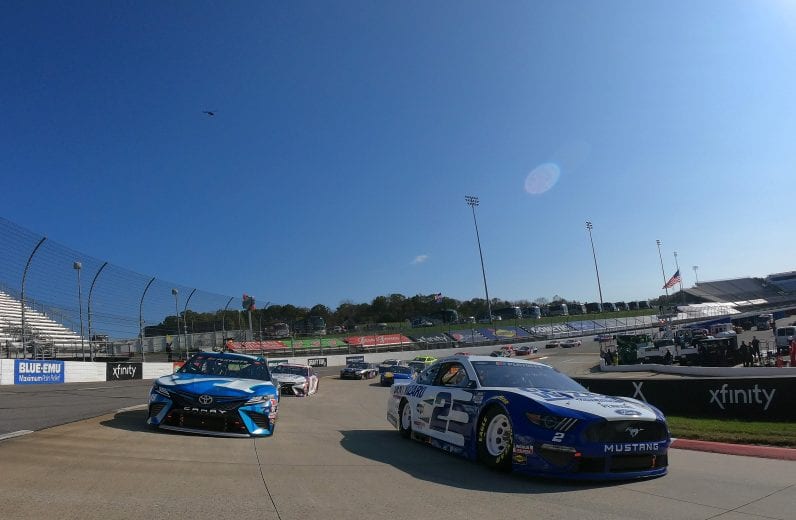 MARTINSVILLE, VIRGINIA - NOVEMBER 01: Brad Keselowski, driver of the #2 Dent Wizard Ford, and Martin Truex Jr., driver of the #19 Auto-Owners Insurance Toyota, lead the field on a pace lap prior to the NASCAR Cup Series Xfinity 500 at Martinsville Speedway on November 01, 2020 in Martinsville, Virginia. (Photo by Jared C. Tilton/Getty Images) | Getty Images