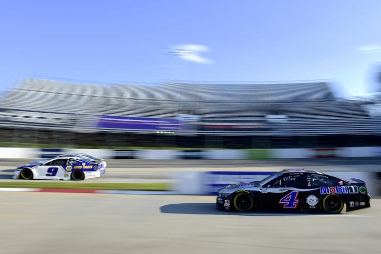MARTINSVILLE, VIRGINIA - NOVEMBER 01: Kevin Harvick, driver of the #4 Mobil 1 Ford, exits pit road as Chase Elliott, driver of the #9 NAPA Auto Parts Chevrolet, passes during the NASCAR Cup Series Xfinity 500 at Martinsville Speedway on November 01, 2020 in Martinsville, Virginia. (Photo by Jared C. Tilton/Getty Images) | Getty Images