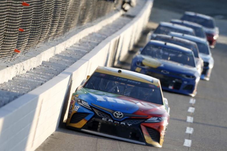 MARTINSVILLE, VIRGINIA - NOVEMBER 01: Kyle Busch, driver of the #18 M&M's Toyota, leads the field during the NASCAR Cup Series Xfinity 500 at Martinsville Speedway on November 01, 2020 in Martinsville, Virginia. (Photo by Brian Lawdermilk/Getty Images) | Getty Images