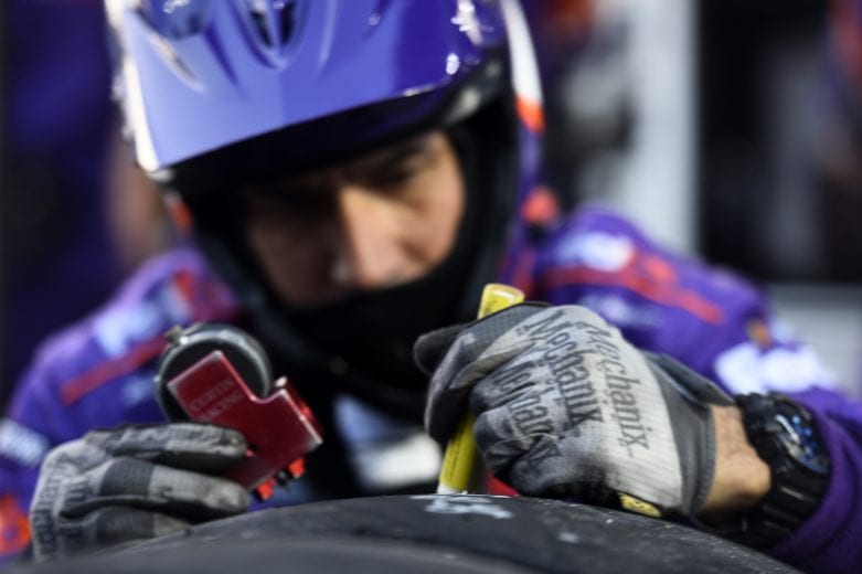 MARTINSVILLE, VIRGINIA - NOVEMBER 01: A crew member of the #11 FedEx Ground Toyota, driven by Denny Hamlin, works on the tires during the NASCAR Cup Series Xfinity 500 at Martinsville Speedway on November 01, 2020 in Martinsville, Virginia. (Photo by Jared C. Tilton/Getty Images) | Getty Images