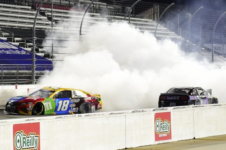 MARTINSVILLE, VIRGINIA - NOVEMBER 01: Kyle Busch, driver of the #18 M&M's Toyota, drives with smoke after an on-track incident with Kevin Harvick, driver of the #4 Mobil 1 Ford, on the last lap during the NASCAR Cup Series Xfinity 500 at Martinsville Speedway on November 01, 2020 in Martinsville, Virginia. (Photo by Jared C. Tilton/Getty Images) | Getty Images