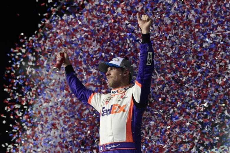 DAYTONA BEACH, FLORIDA - FEBRUARY 17: Denny Hamlin, driver of the #11 FedEx Express Toyota, celebrates in Victory Lane after winning the NASCAR Cup Series 62nd Annual Daytona 500 at Daytona International Speedway on February 17, 2020 in Daytona Beach, Florida. (Photo by Jared C. Tilton/Getty Images) | Getty Images