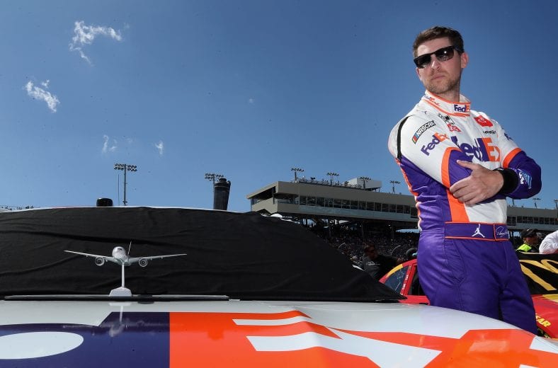 AVONDALE, ARIZONA - MARCH 08: Denny Hamlin, driver of the #11 FedEx Freight Toyota, stands on the grid before the NASCAR Cup Series FanShield 500 at Phoenix Raceway on March 08, 2020 in Avondale, Arizona. (Photo by Christian Petersen/Getty Images) | Getty Images