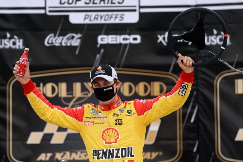 KANSAS CITY, KANSAS - OCTOBER 18: Joey Logano, driver of the #22 Shell Pennzoil Ford, celebrates in Victory Lane after winning the NASCAR Cup Series Hollywood Casino 400 at Kansas Speedway on October 18, 2020 in Kansas City, Kansas. (Photo by Chris Graythen/Getty Images) | Getty Images