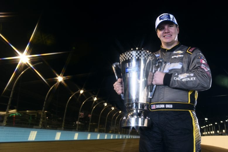 AVONDALE, ARIZONA - NOVEMBER 06: (EDITOR'S NOTE: This image was created using a starburst filter) Sheldon Creed, driver of the #2 Chevy Accessories/Trench Shoring Chevrolet, poses for a photo after winning the NASCAR Gander RV & Outdoors Truck Series Championship at Phoenix Raceway on November 06, 2020 in Avondale, Arizona. (Photo by Jared C. Tilton/Getty Images) | Getty Images