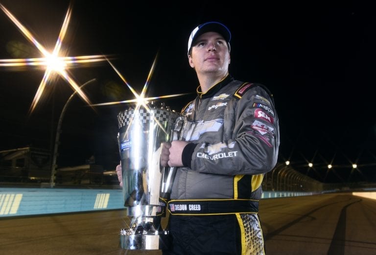 AVONDALE, ARIZONA - NOVEMBER 06: (EDITOR'S NOTE: This image was created using a starburst filter) Sheldon Creed, driver of the #2 Chevy Accessories/Trench Shoring Chevrolet, poses for a photo after winning the NASCAR Gander RV & Outdoors Truck Series Championship at Phoenix Raceway on November 06, 2020 in Avondale, Arizona. (Photo by Jared C. Tilton/Getty Images) | Getty Images