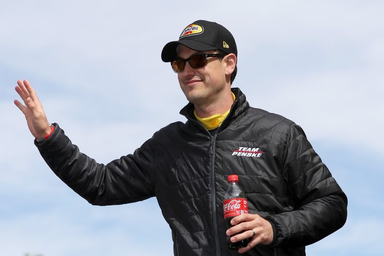 Joey Logano waves to fans at Las Vegas